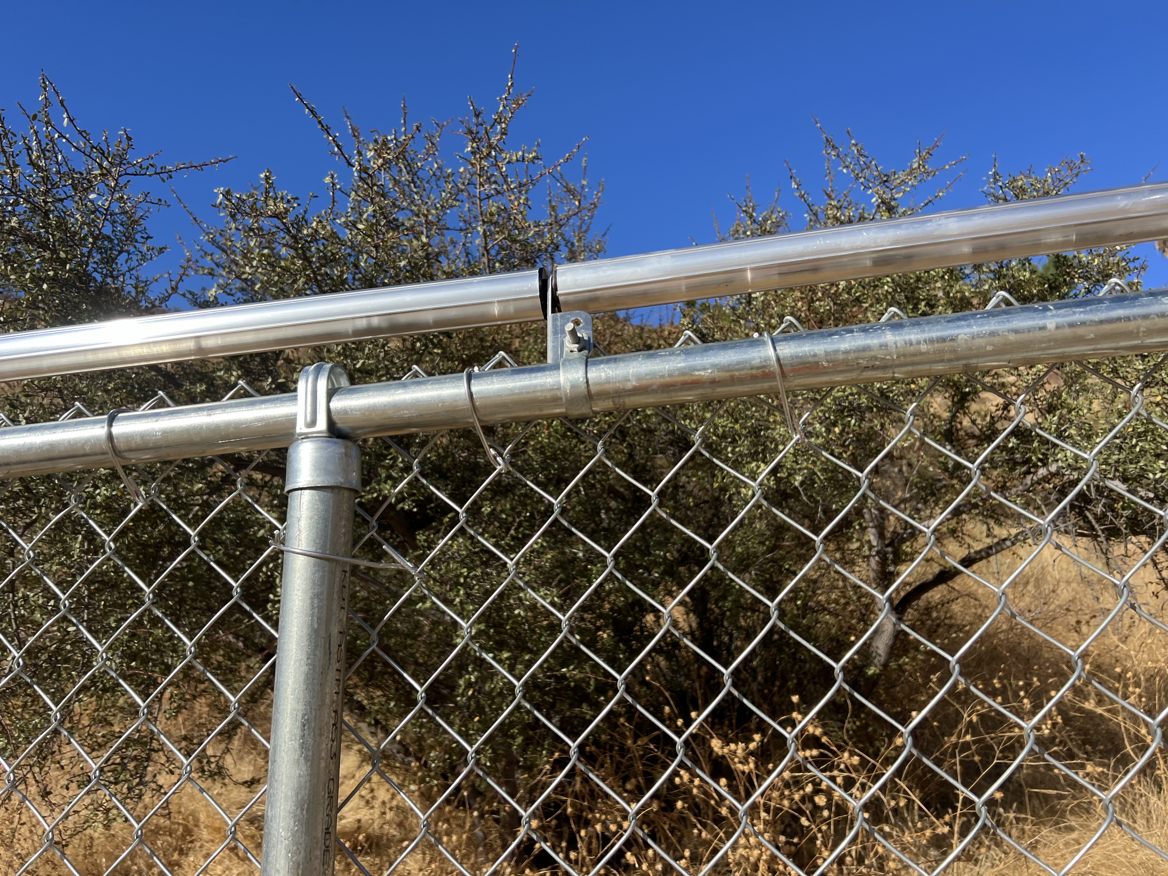 Galvanized chain-link top rail and mesh detail
