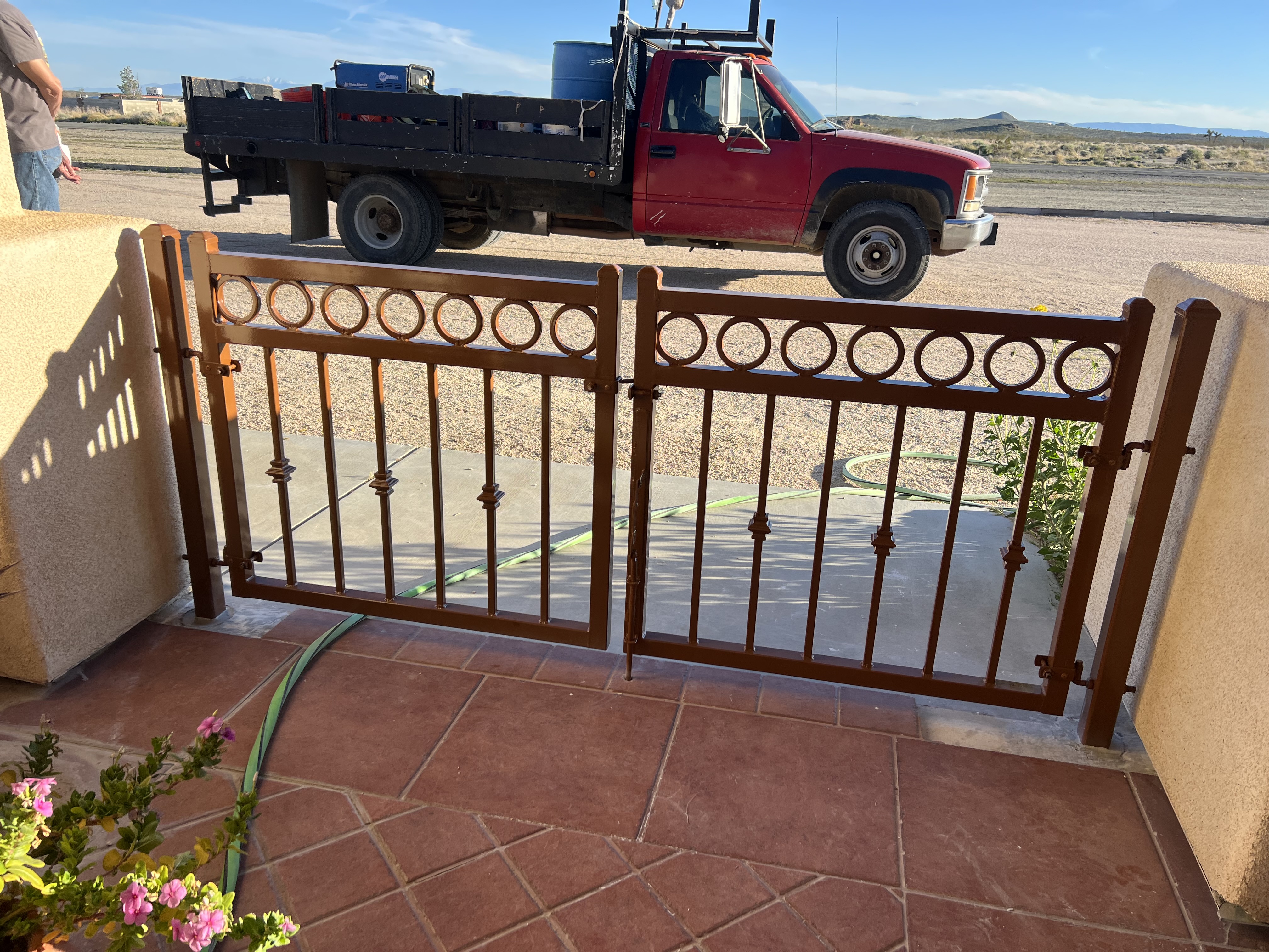 Ornamental iron double gate — front view open