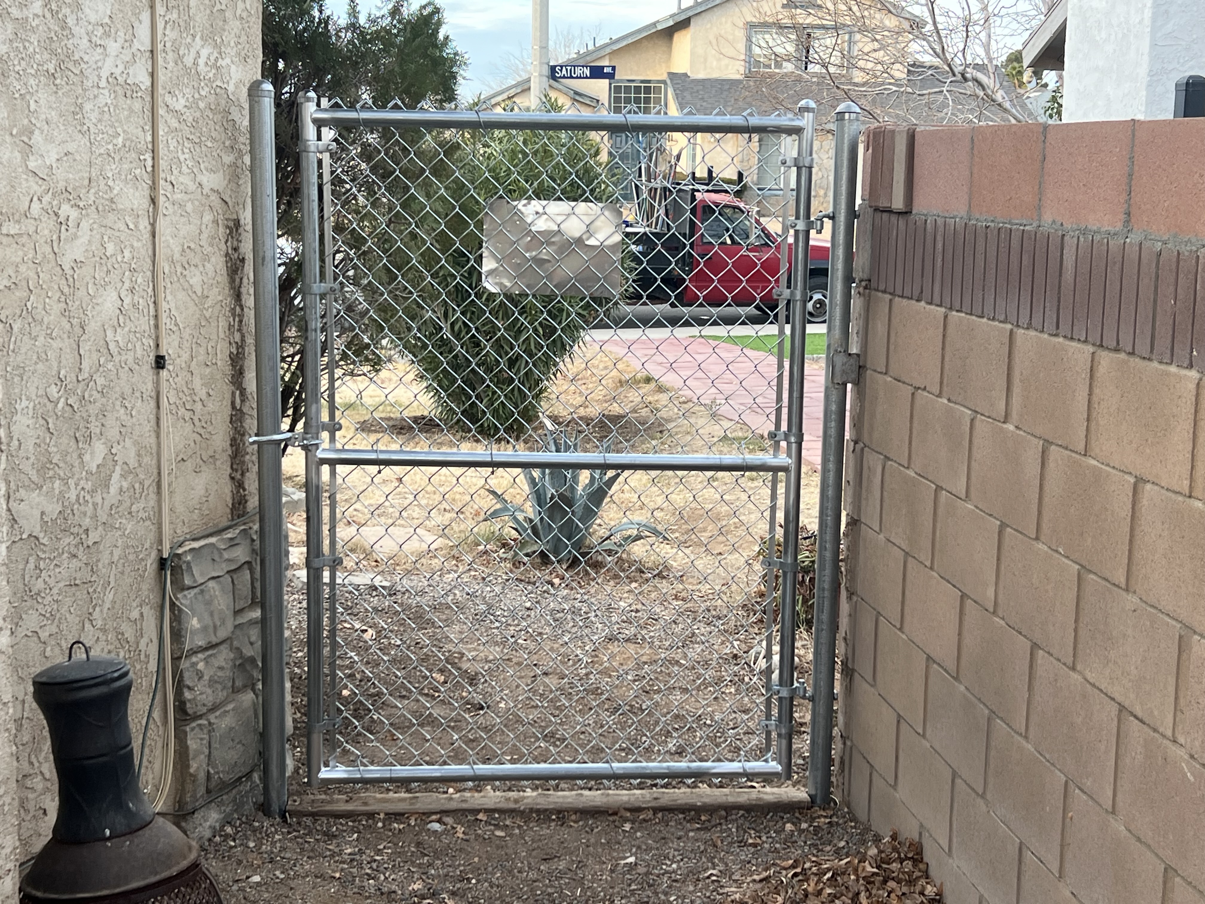 Galvanized chain-link gate installation