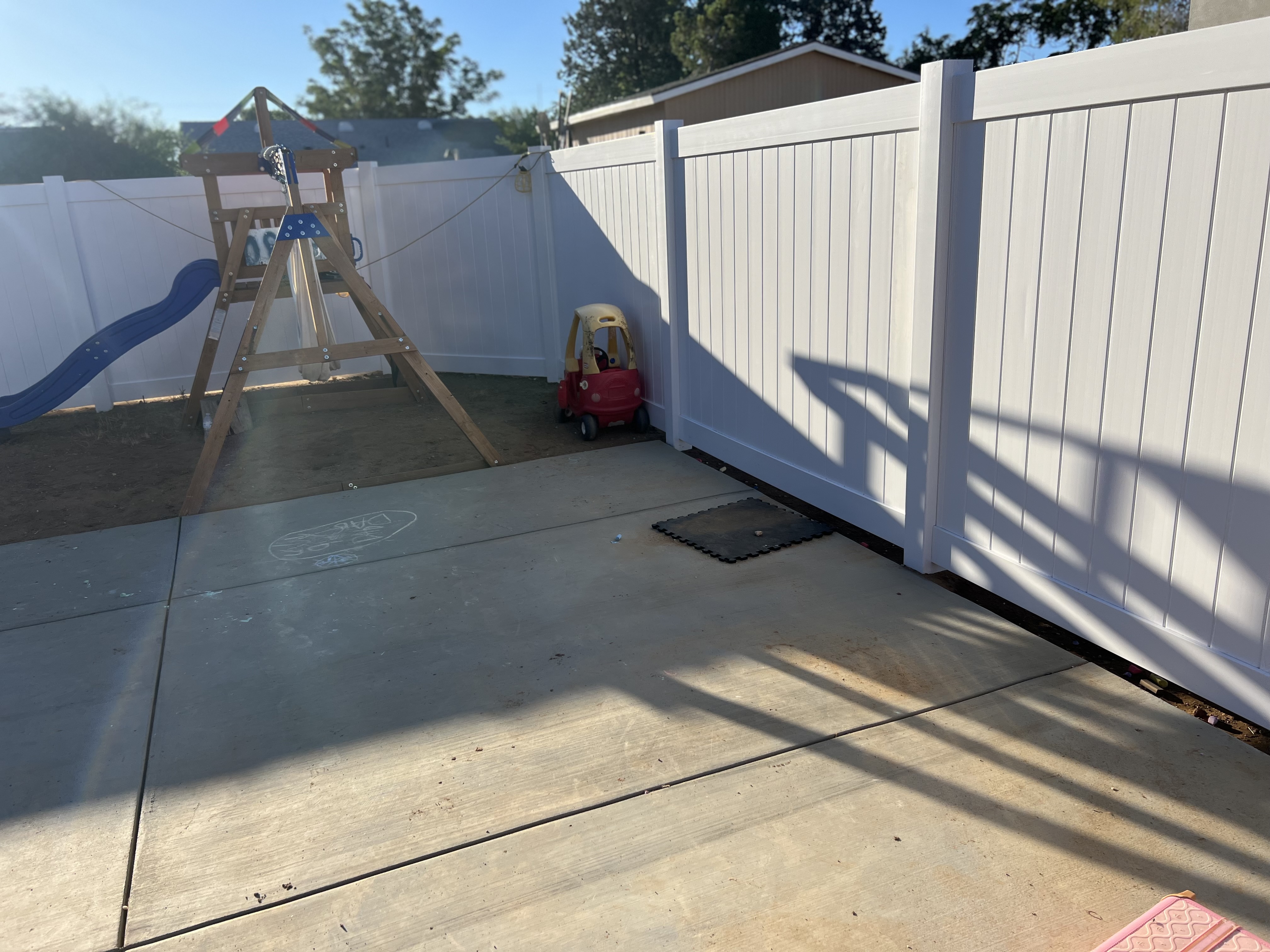 White vinyl full-privacy backyard fence