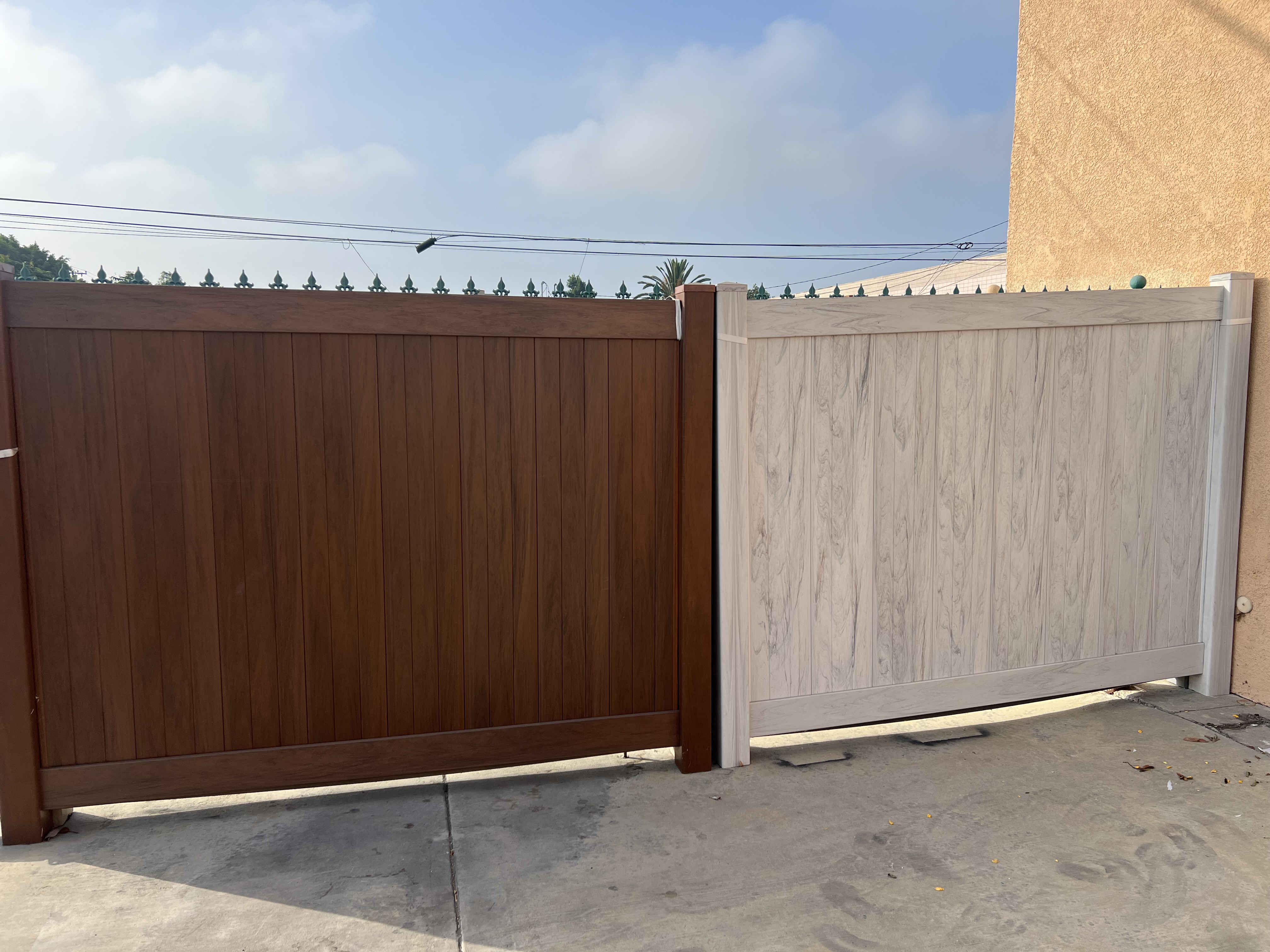 Composite gates in dark walnut and light gray wood-grain